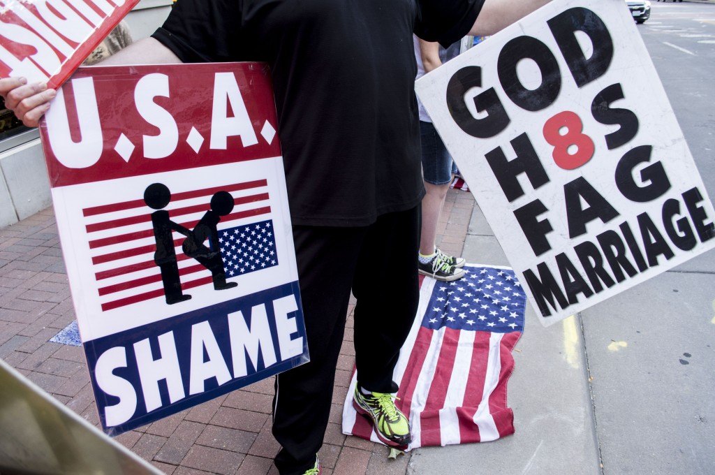 As part of our ambassadorship WBC must bedraggle your filthy God-defying flag, because it is in our job description. Check it out, for example, in Deuteronomy 33:29: “Happy art thou, O [Westboro Baptist Church]: who is like unto thee, O people saved by the LORD, the shield of thy help, and who is the sword of thy excellency! and thine enemies shall be found liars unto thee; and thou shalt tread upon their high places.”